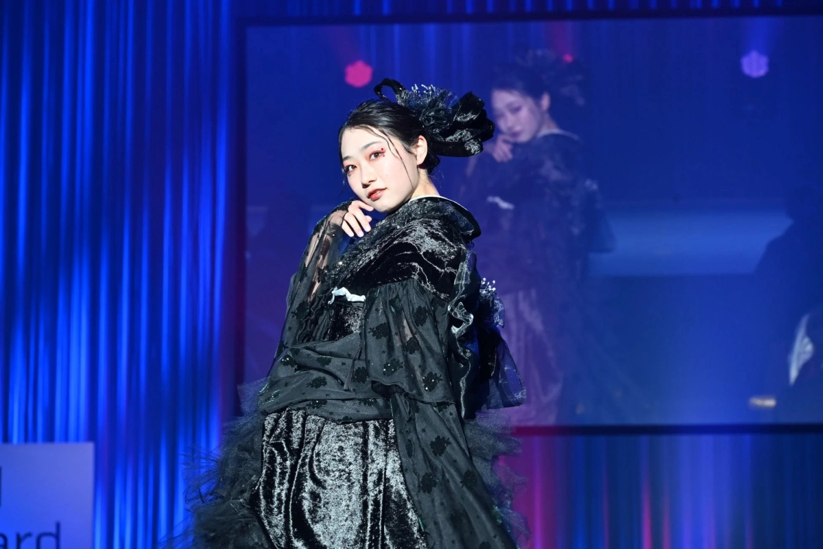 Model in black modern kimono on stage