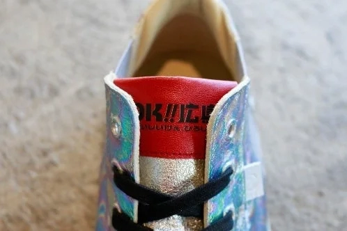 Close-up of sneaker tongue with OK!! Hiroshima logo