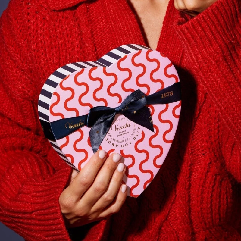 Person holding Venchi heart gift box