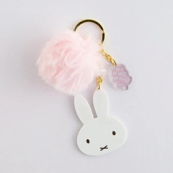 Close-up of Miffy Fur Keychain with small flower charm