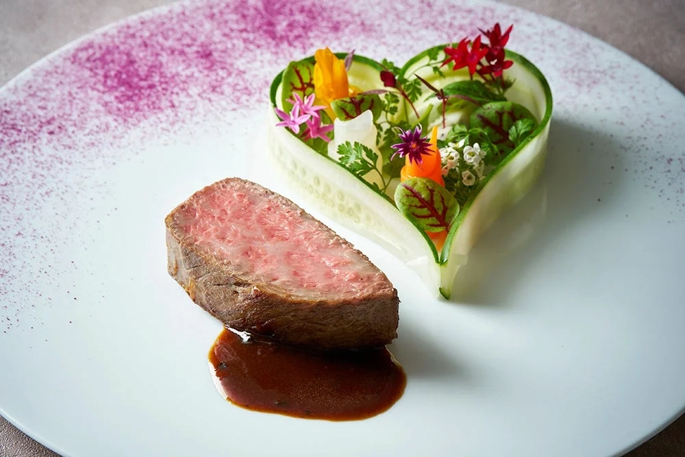 Exquisite steak dish with heart-shaped garnish