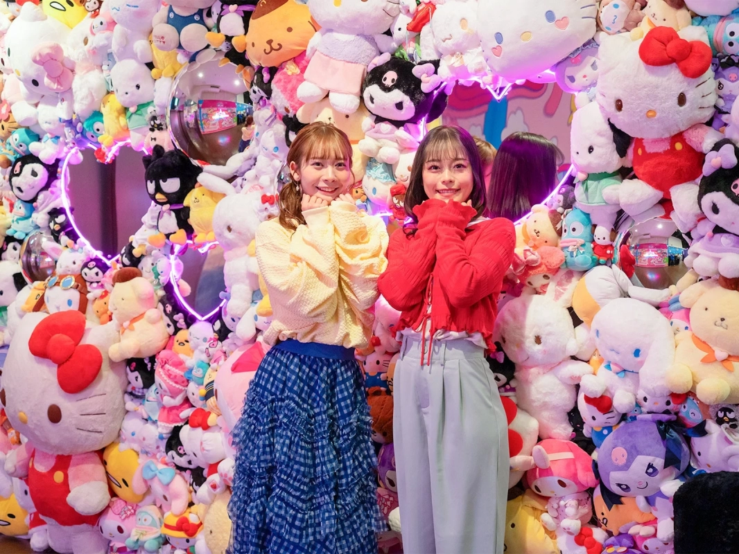 Guests posing with Sanrio plushies