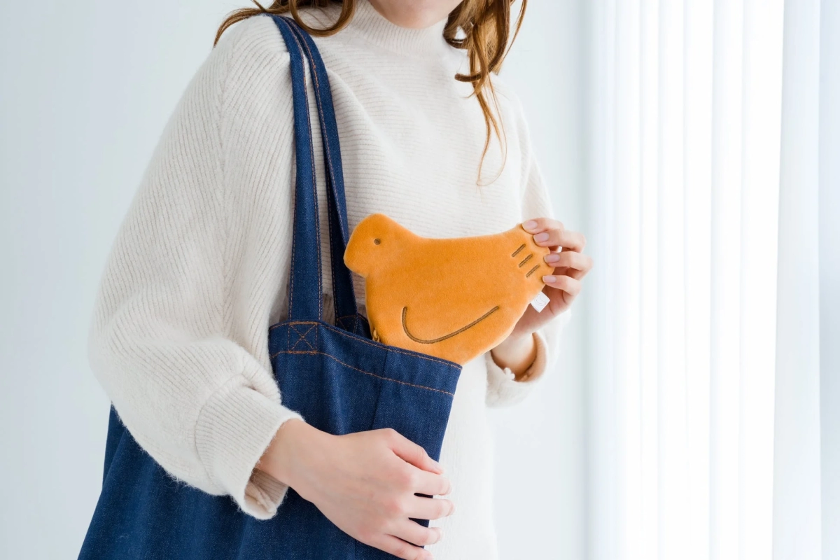 Hato Poppo Pouch in a denim tote bag