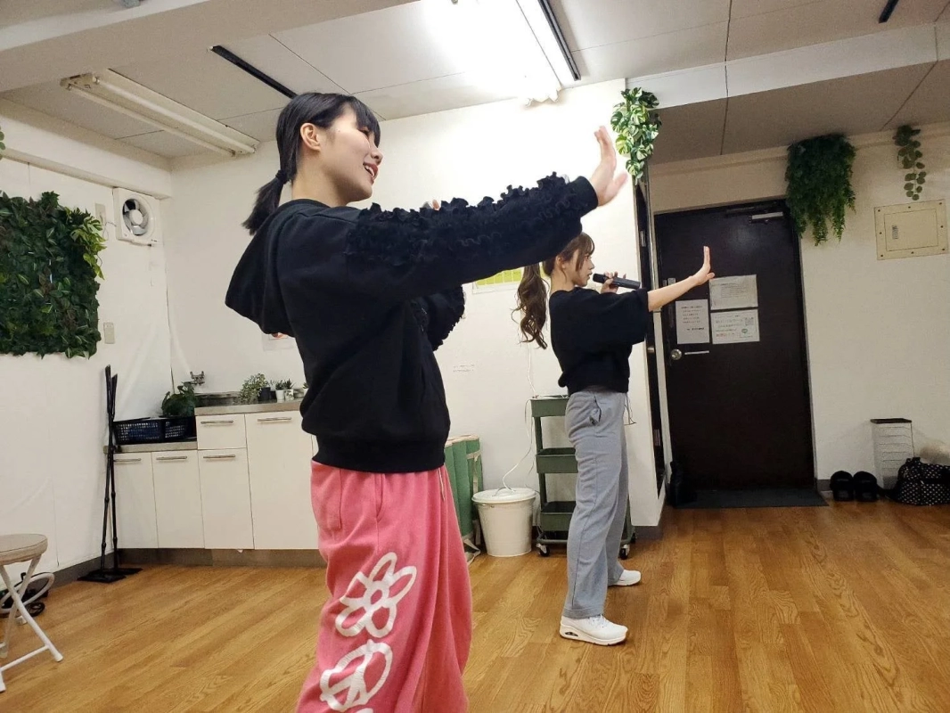Two women practicing in a studio