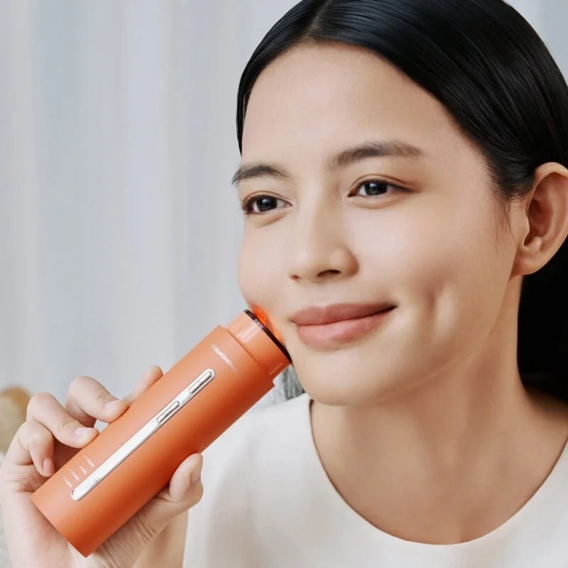 Woman Using LIFT2 Multi-Esthe Beauty Device