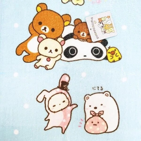Rilakkuma, Sumikkogurashi and friends on a blue face towel