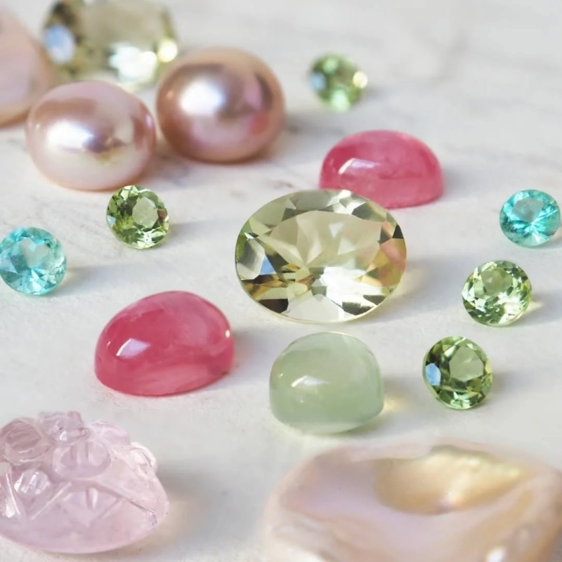 Various colorful gemstones and pearls