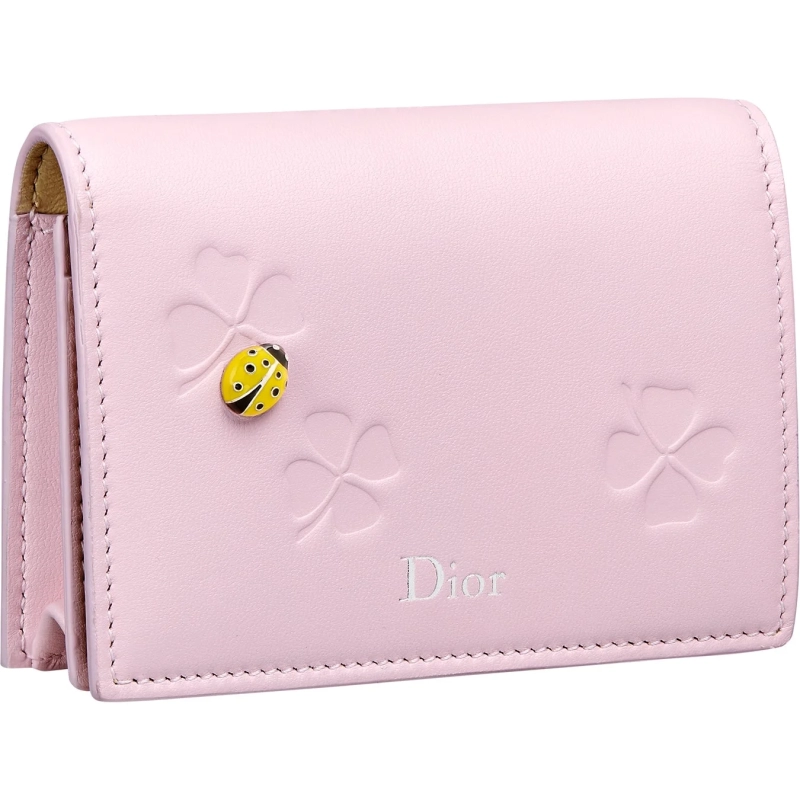 Pink mini wallet with clover detail and a yellow ladybug
