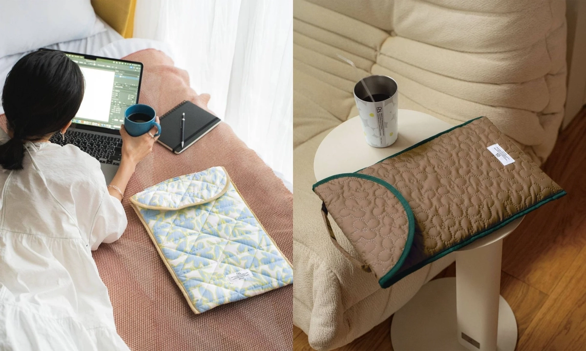 Person using a laptop sleeve with a coffee mug