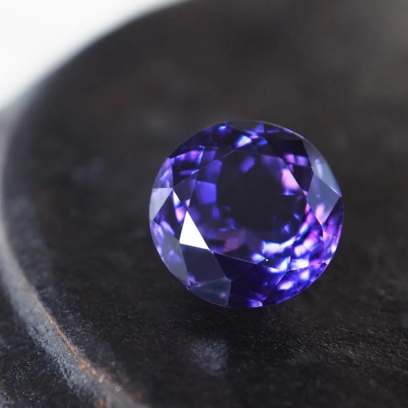 Close-up of a round purple gemstone