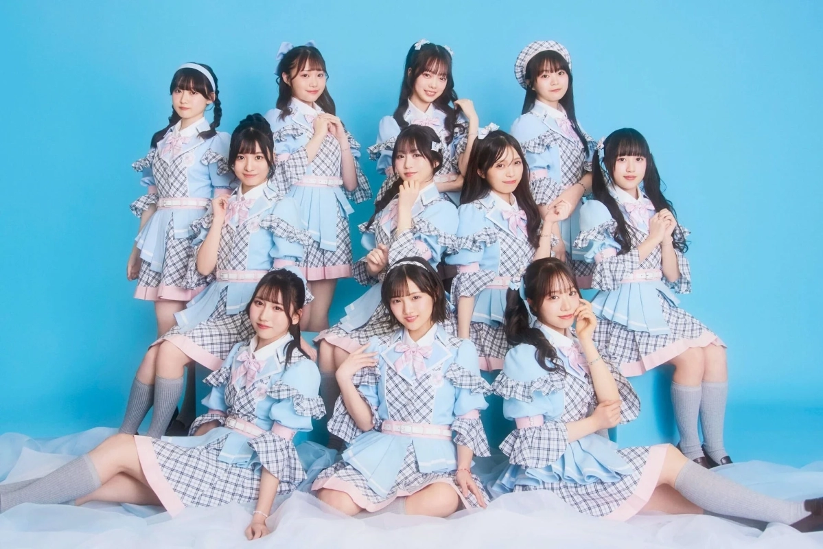 α+ group photo in pastel uniforms