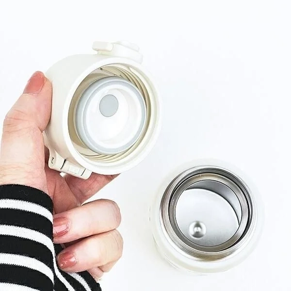 Hand Holding Bottle Cap