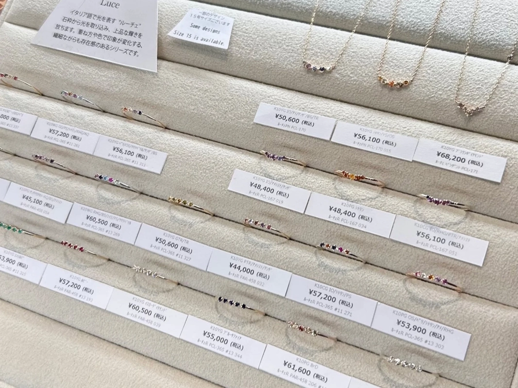 Display of Luce rings and pendants with price tags