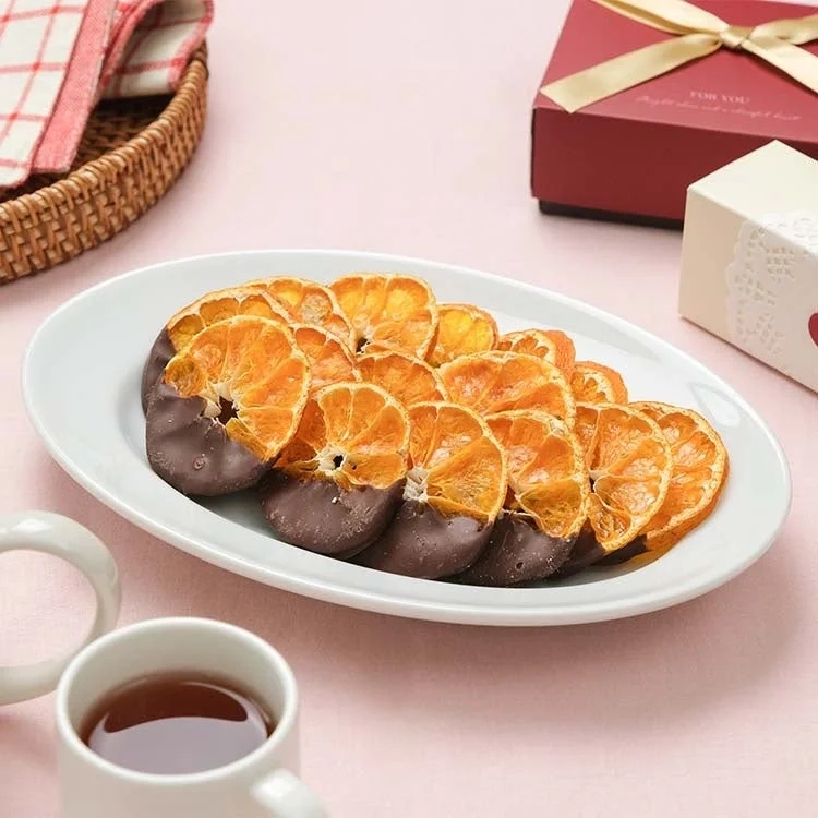 Mandarin Orange Chocolate on a plate with gift and tea