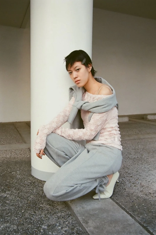 Pink sheer top, grey sweats, heels