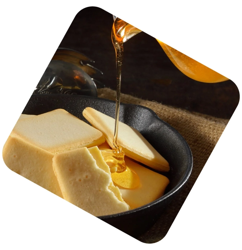 Honey being poured over a cookie