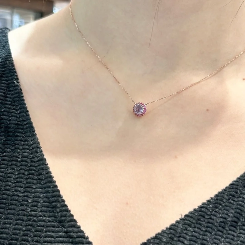 Necklace with a pink and purple circular pendant