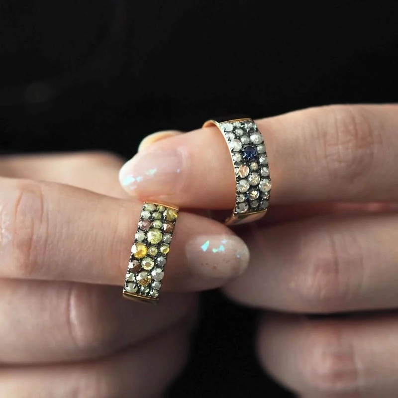 Two ornate rings with multiple gemstones