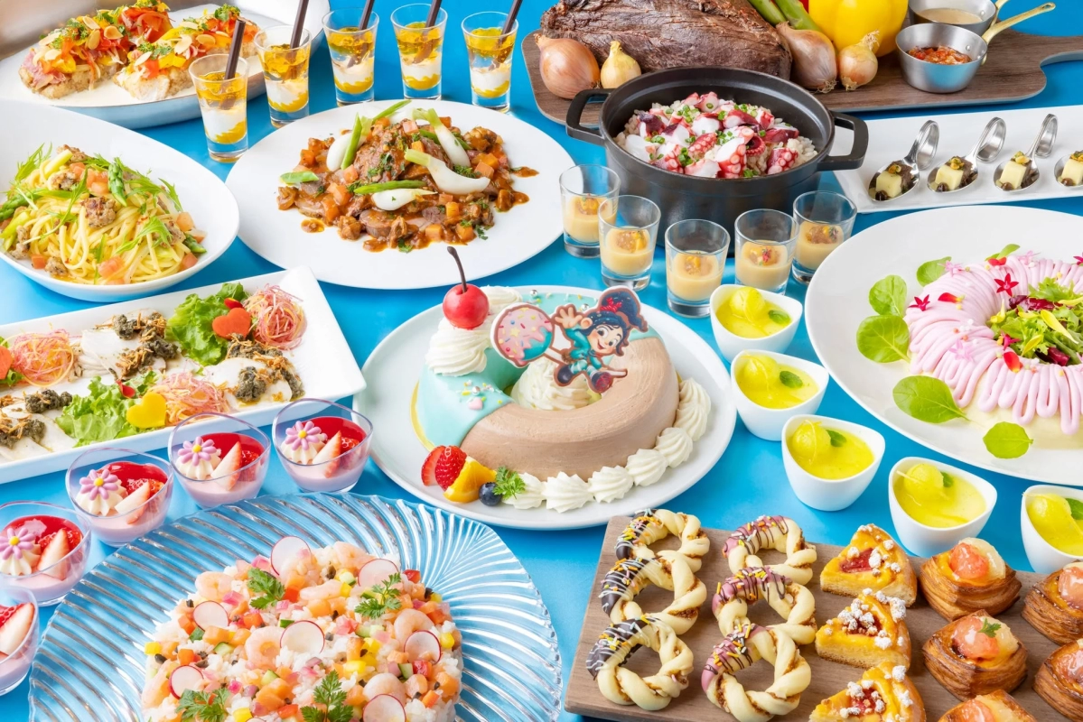Colorful buffet spread with various dishes and desserts themed to Vanellope