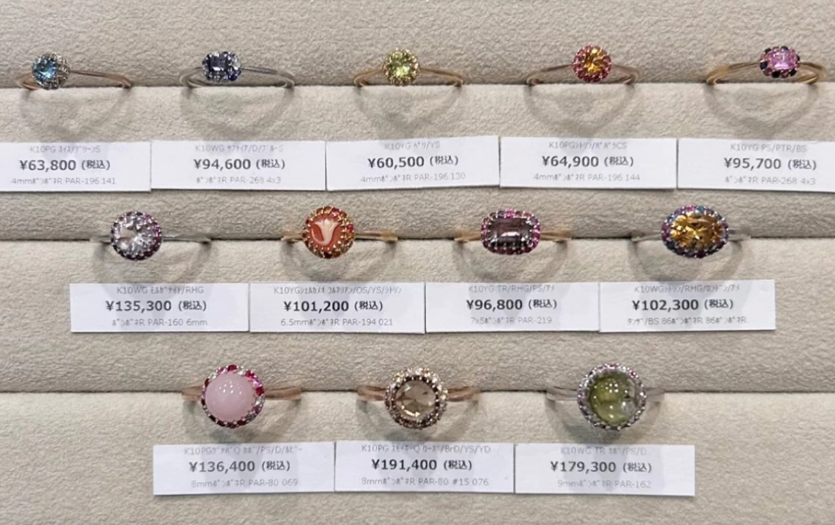 Display of Pomponne rings with price tags