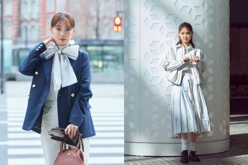 A woman in a navy blazer with a large bow tie and another in a striped set-up.