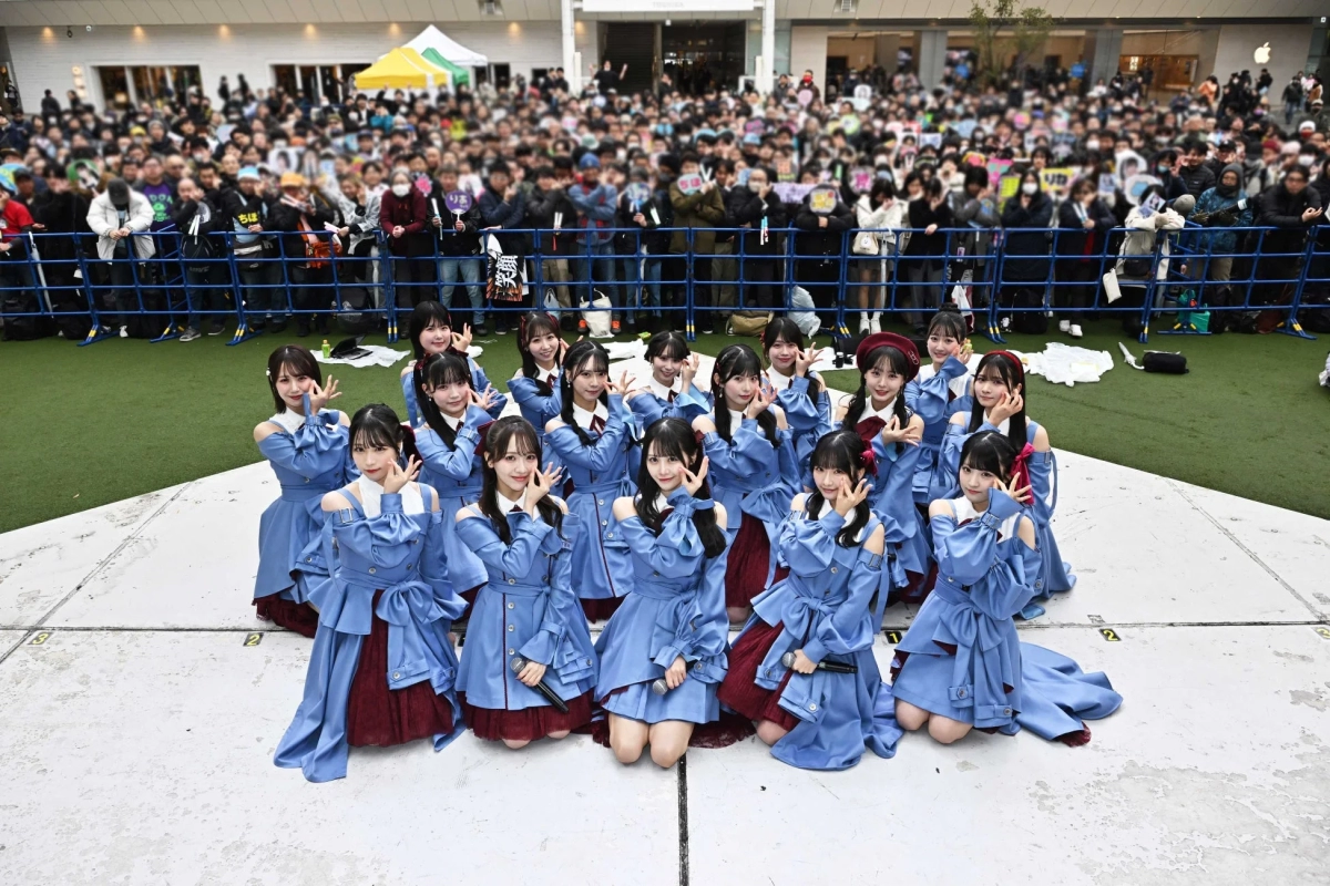STU48 group on outdoor stage with crowd