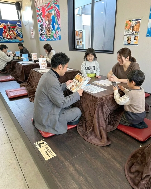 Family enjoying a meal in a Japanese-style restaurant