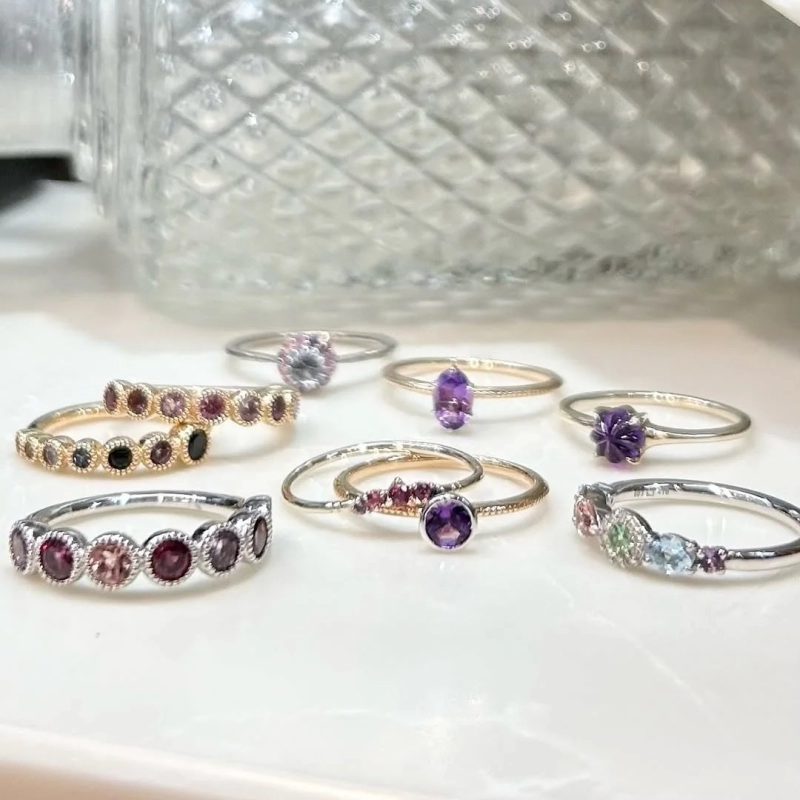 Various rings with amethyst and other colored stones