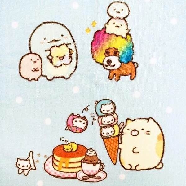 Sumikkogurashi and Afro Ken-like character on a blue face towel