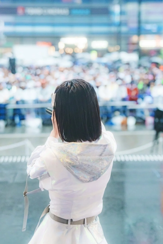 iLiFE! performing on stage to a large crowd
