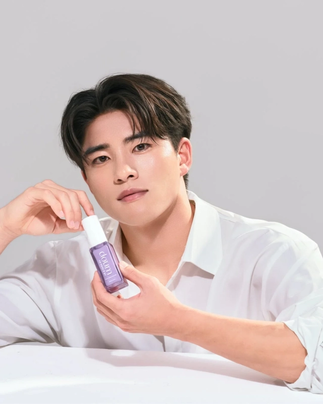 Fuga Sakurai holding a doum skincare product