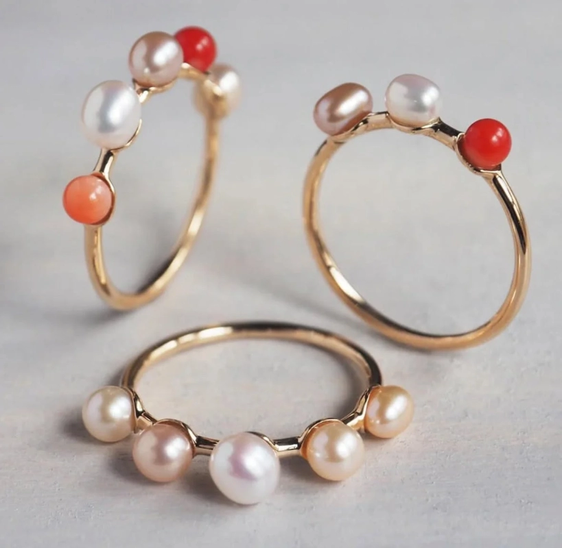Three pearl and coral rings