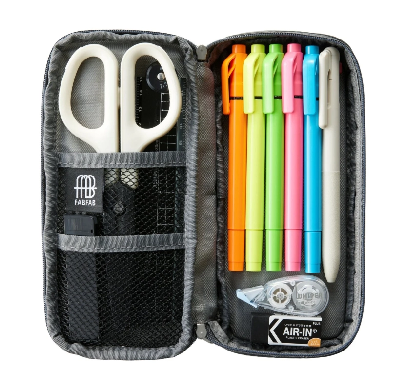 Close-up of the second tier of the FABFAB pen case, filled with various stationery items