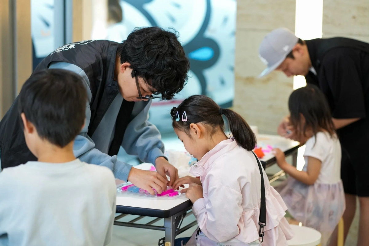 Children and adults participating in a workshop