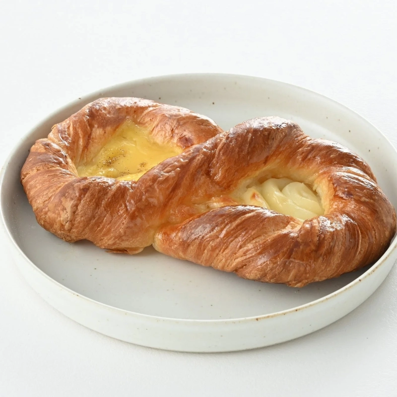 A twisted Danish pastry filled with two types of creamy custard.