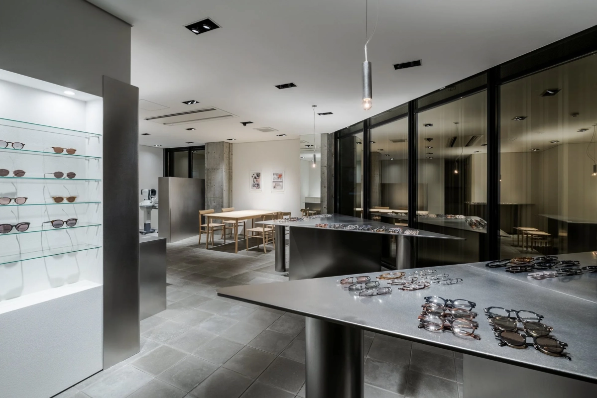 Modern eyewear store interior with displays and consultation area