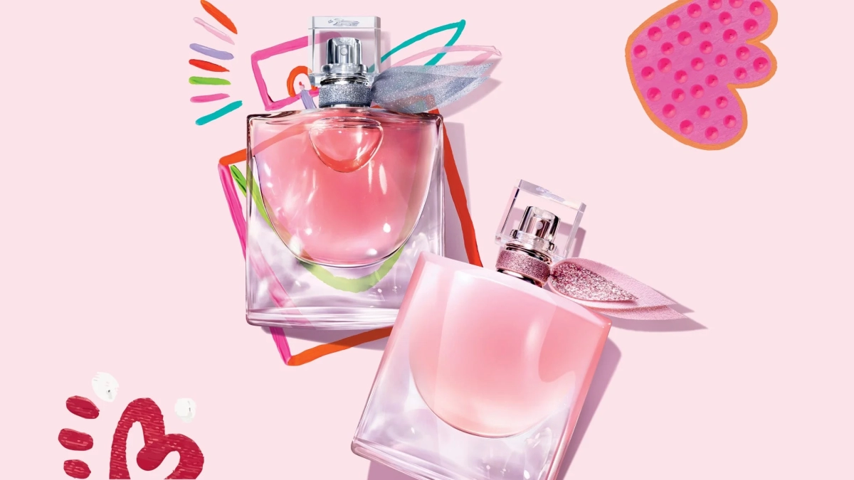 La Vie Est Belle perfume bottles with abstract background