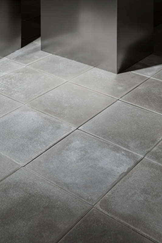 Close-up of gray concrete-like floor tiles