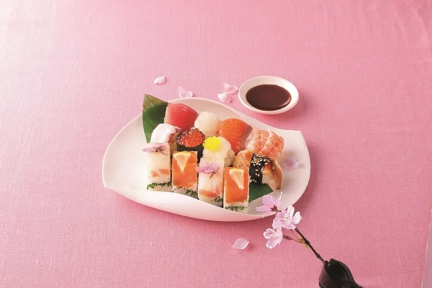 Colorful temari sushi with cherry blossom petals