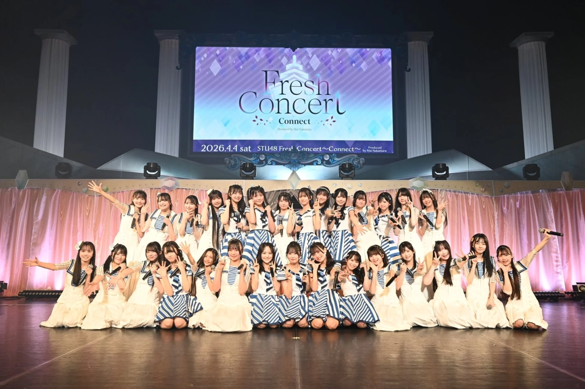 STU48 members in sailor-style outfits posing on stage