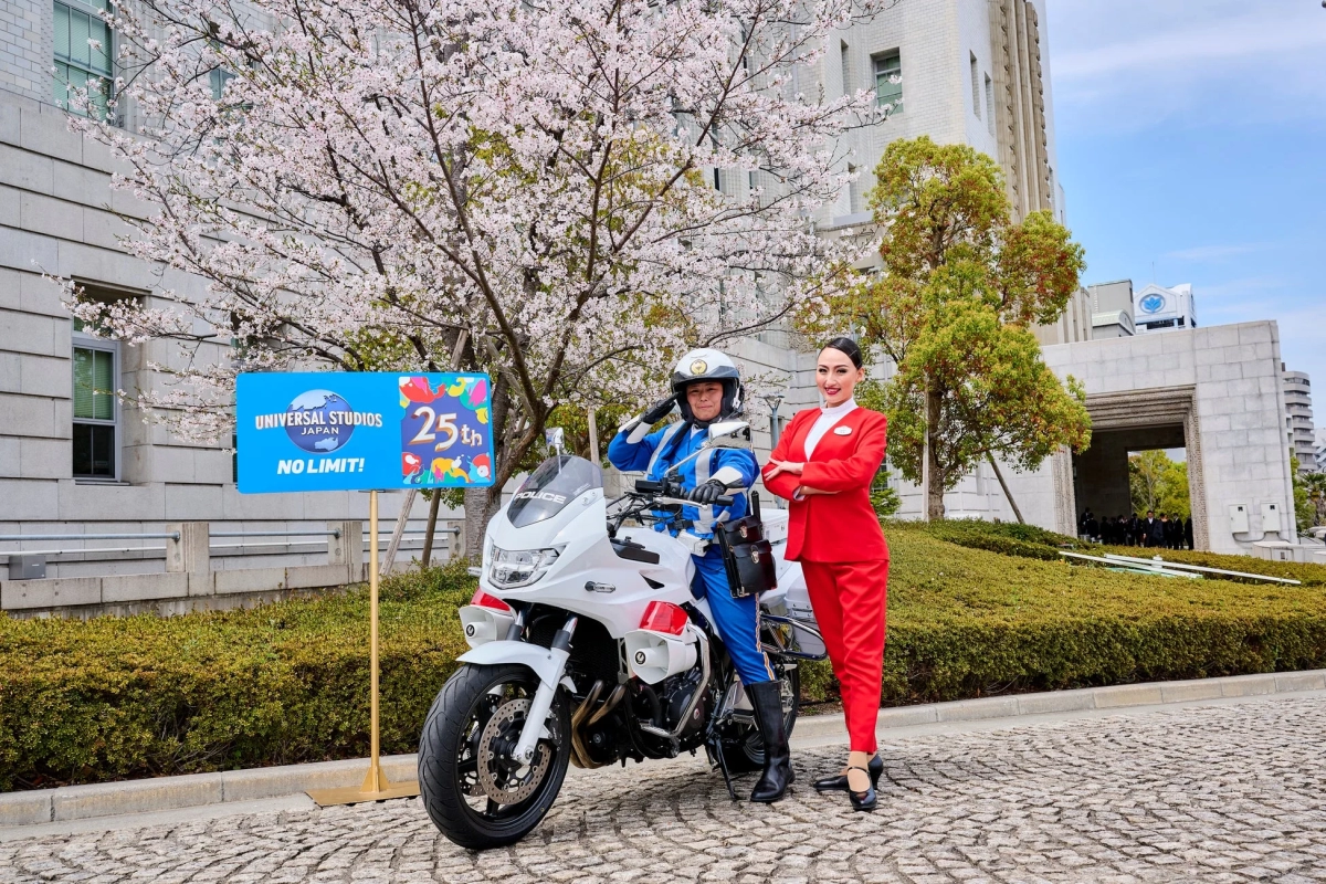 Police, woman in red, white bike, cherry blossoms