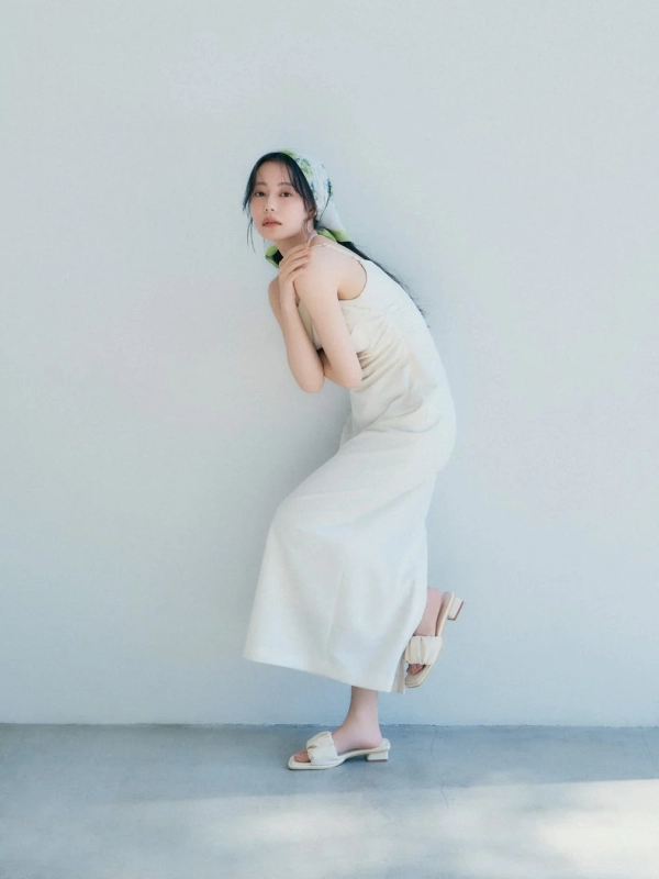 Model in cream slip dress with scarf