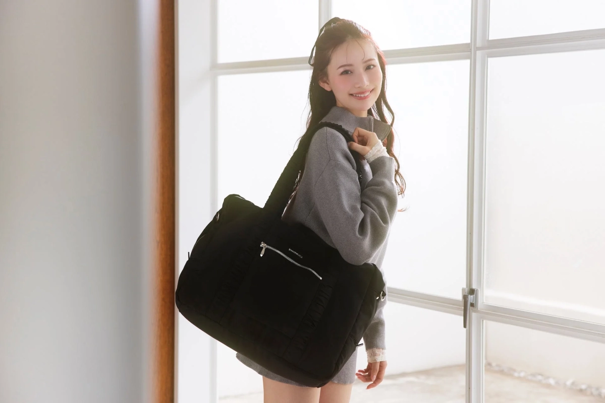 Kotomi Tachibana with a black boston bag from Samantha Vega's Travel Collection