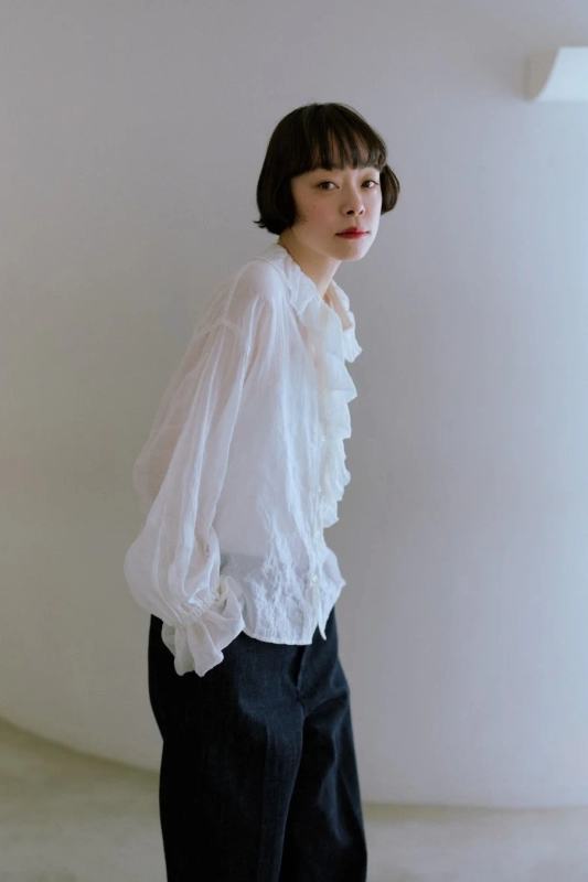 Kanoco in white frill blouse