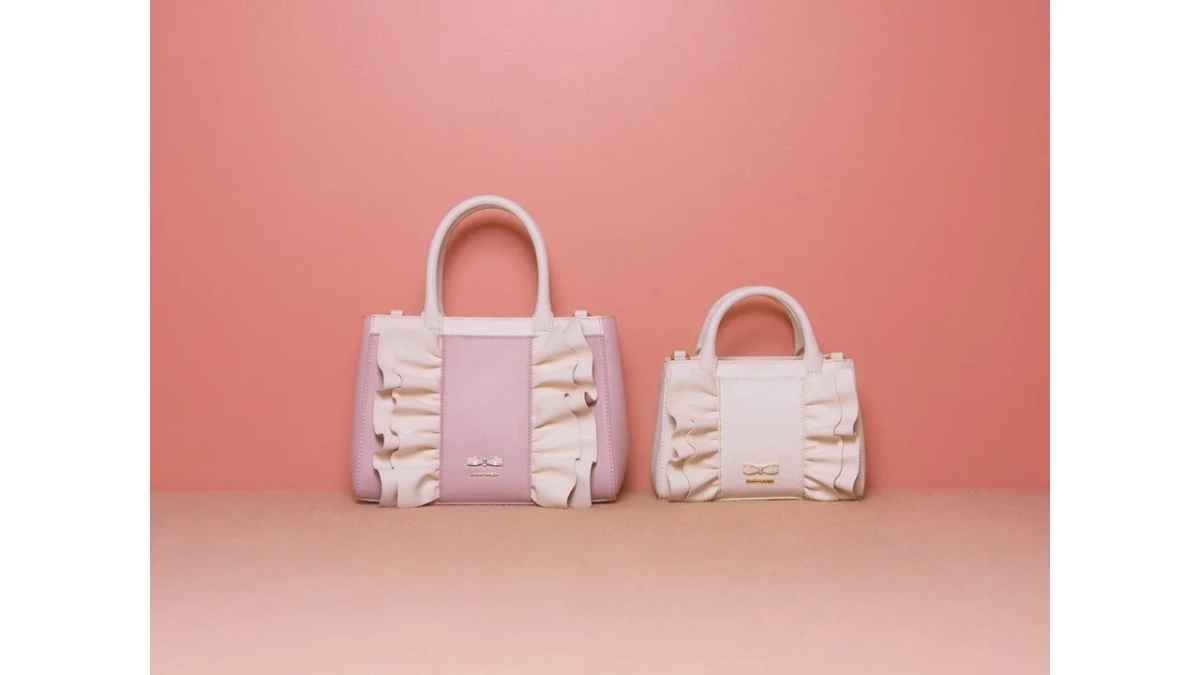 Close-up of Samantha Vega's French Girly handbags with frills and ribbon hardware