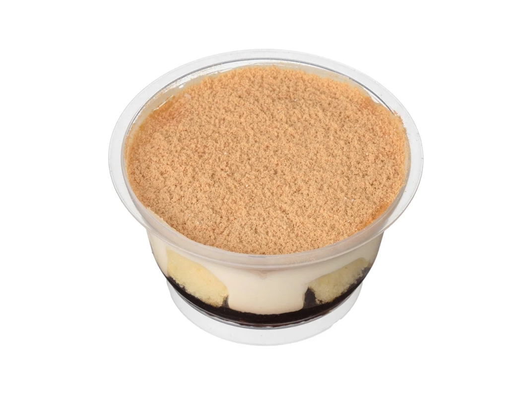 A close-up of Pakitto Tiramisu Kuromitsu Kinako Mochi, showing layers of kinako, cream, and cake in a transparent cup.