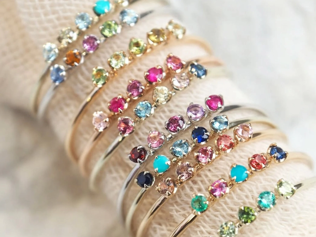 Close-up of Luce rings with colorful stones