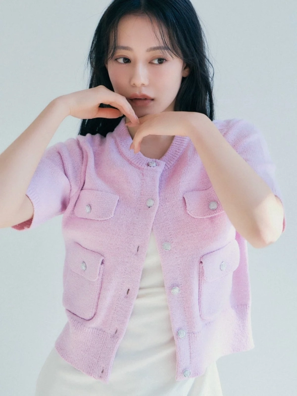 Model in pink short-sleeved cardigan